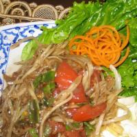 Laos Style Papaya Salad · Spicy. Shredded raw papaya mixed with tomatoes, long bean, fresh chili, fresh Lao’s makok, a...