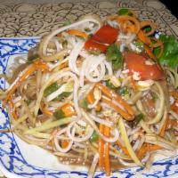 Tum Soya Noodles · Spicy. Shredded raw papaya, tomatoes, long bean, cabbage, carrot, chili, noodles, and homema...