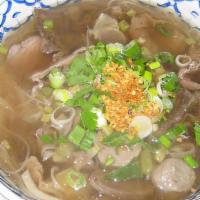 Beef Noodle Soup (Pho Original) · A large bowl of clear beef noodles soup with rare slice of steak, well done steak, tendon, t...