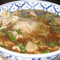 Thai Bbq Beef Noodle Soup (Pho-Thai) · Thai BBQ beef noodle soup (pho-Thai) a large bowl of rice noodles soup with rare slice of be...