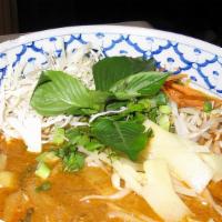 Khao Poun · Choice of chicken or fish curry with rice vermicelli, fresh vegetables, and meatballs.