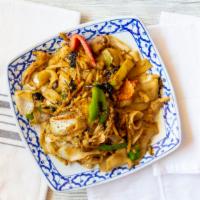 Drunken Noodle · Soft wide rice noodle with long bean, carrot, baby corn, onion and holy basil. Choice of bee...