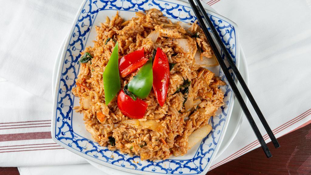 Curry Fried Rice · Stir fried rice with curry, coconut milk, mint, red pepper, green pepper, onion, baby corn, and bamboo. Choice of beef, pork, chicken.