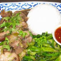 Kao Kha Moo · Steamed rice with stewed pork, hock, and Chinese broccoli serve with chili sauce.