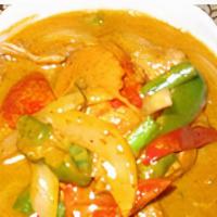Panang Curry · Spicy. Choice of meat with onion, carrot, fresh pepper, and coconut milk in our panang curry...