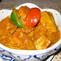Mussamun Curry · Spicy. Choice of meat with onion, potato, fresh pepper, peanut, and coconut milk in our muss...