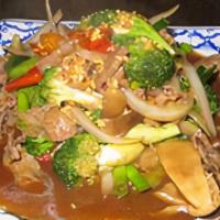 Beef With Oyster Delight · Slice beef stir fried with mushroom, green onion, carrot, baby corn, and onion in tasty oyst...