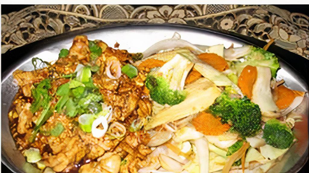Perfect Stranger · Popular Thai dish. Your choice of chicken, beef, pork, or substitute for shrimp or seafood sautéed in a garlic-pepper sauce and sautéed vegetables on the side.