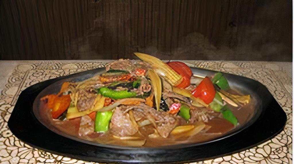 Siam Sizzling · Spicy. Choice of chicken, beef, pork, or substitute for shrimp, with mushroom, onion, baby corn, and bell pepper in Thai spice sauce.