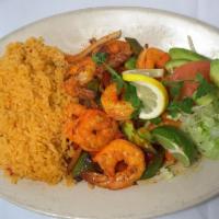 Camarones A Las Brazas · Char Broiled butterfly shrimp with red, green peppers, onions and served with rice