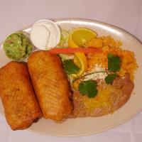 2 Chimichangas Dinner · 2 large chimichangas with your choice of meat, served with rice & beans, side of guacamole a...