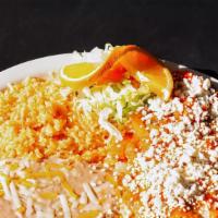Chile Relleno Dinner · One large chile relleno stuffed with cheese with salsa ranchera on top, served with rice bea...