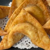 Crab Rangoon · A rich and creamy blend of imitation crabmeat, cream cheese, and light green onion wrapped i...