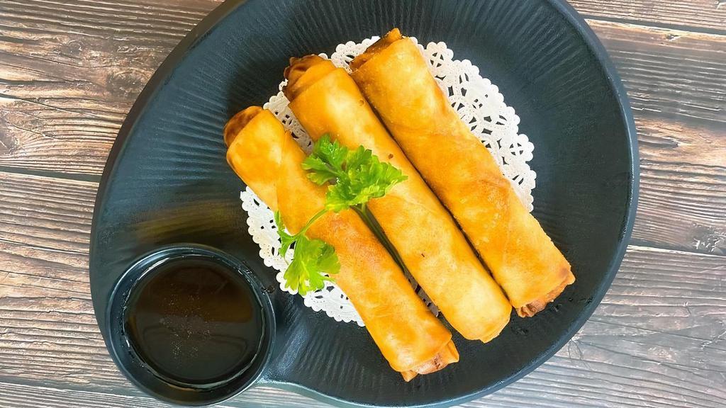 Chicken Egg Rolls · Ground Chicken with mix vegetable and spices, deep fried till crispy with sweet and sour sauce.