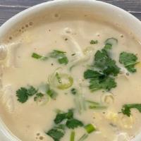 Tom Ka Kai Soup · Creamy coconut milk simmered with galangal, lemongrass, kaffir lime leaves, mushrooms, napa ...