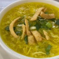 Egg Drop Soup · A Chinese classic simmer with egg topped with a crispy wonton