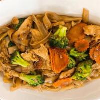 Pad See Ew · The typical Thai street food. Stir-fried large flat rice noodles with egg, broccoli, carrots...