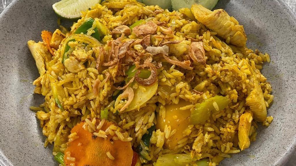 Yellow Fried Rice W/Cuc Salad · Fried Rice with yellow curry seasoning, egg, onion, carrot, bell pepper, celery and your choice of meat. Served with cucumber salad