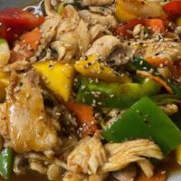Mango Delight · Stir-fried fresh mango, onion, mushroom, bell pepper, carrot and your choice of meat with ho...
