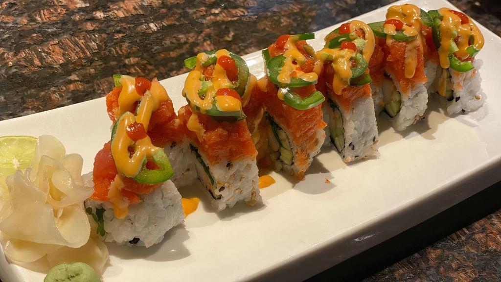 Dynamite Roll · Imitation crabmeat, cucumber, cilantro, Thai basil; topped with spicy tuna, jalapeno, spicy mayo and sriracha with side of lime wedge