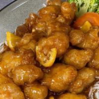 Orange Peel Chicken · Crispy chicken tossed with a sweet & tangy orange sauce and fresh orange peel. Served with s...