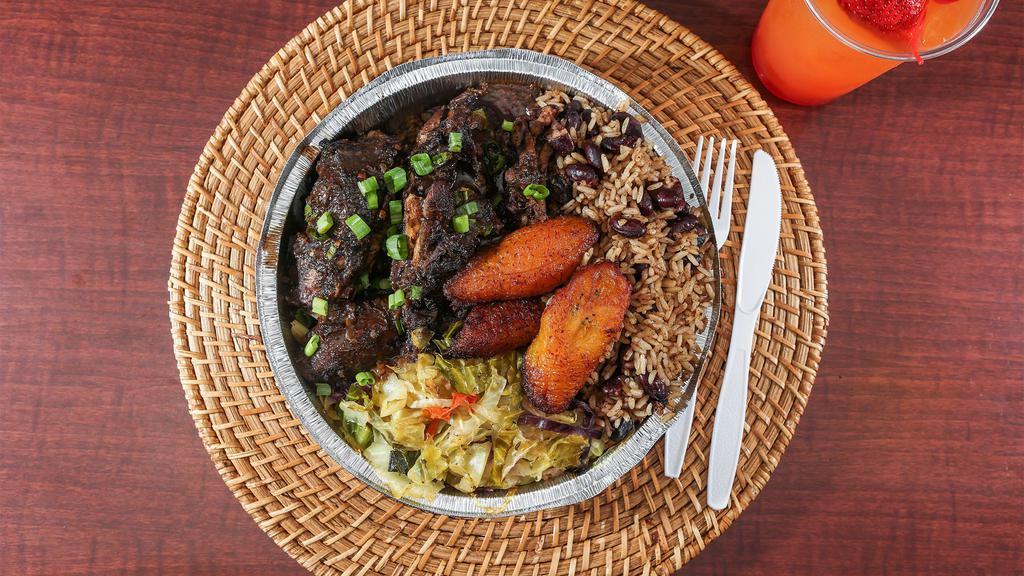 Jerk Chicken · Chopped bone in Chicken marinated in our Scotch Bonnet Pepper Jerk sauce and grilled to perfection. This dish is extra spicy!