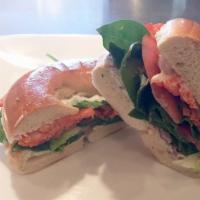 Salmon Bagel · Smoked salmon lox with capers, red onion, tomato, forest greens, lemon aioli, and herb cream...