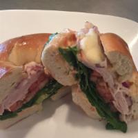 Turkey Bagel · Smoked turkey with provolone cheese, tomato, red onion, forest greens, and sundried tomato c...