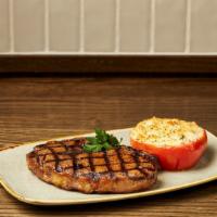 Ribeye · 14oz., served with Gorgonzola crusted thick-cut broiled beefsteak tomato