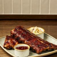 Dry Rub Baby Back Ribs · slow cooked to perfection, BBQ sauce, french fries & chipotle coleslaw