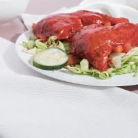 Tandoori Chicken Salad · 2 pieces of dark meat marinated in yogurt, garlic, ginger and chef's spices.