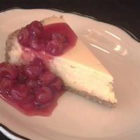 Cheesecake · Graham cracker crust and tart cherry sauce.