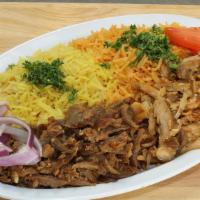 Combination Shawarma Platter (Steak & Chicken) · Served with tomatoes, onions, tahini sauce, garlic sauce, two pitas, rice, and side house sa...