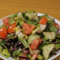House Salad · Lettuce, tomato, cucumber, green pepper, red cabbage, lemon and olive oil.