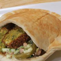 Falafel Sandwich · Hummus, pickles and Jerusalem salad.