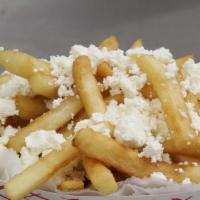 Feta Cheese Fries · Topped with crumbled feta and fresh herbs.
