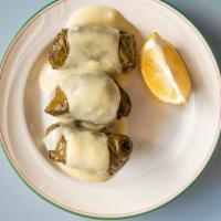 Stuffed Grapeleaves Dinner · Three marinated grapeleaves filled with a fabulous blend of ground beef, rice and onions top...