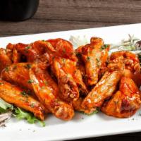 House Chicken Wings · Spicy wing sauce.
