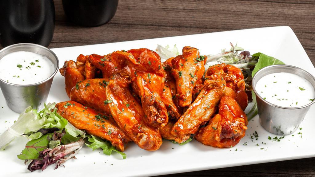 House Chicken Wings · Spicy wing sauce.