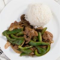 Pepper Steak · Marinated flank steak sautéed with onion, green bell peppers in a brown sauce.