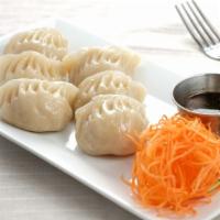 Dumplings (4) · Choice of pork or veggie (100% vegetarian) dumplings, served steamed or pan-fried with a lig...