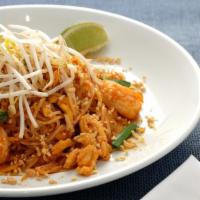 Pad Thai · Stir fried Thai rice noodles with bean sprout, scallion, carrot, egg, and topped with crushe...
