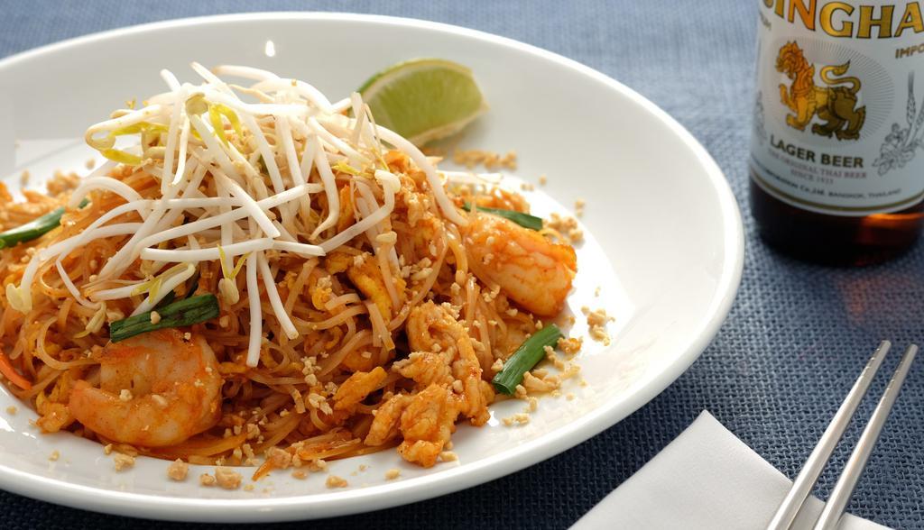 Pad Thai · Stir fried Thai rice noodles with bean sprout, scallion, carrot, egg, and topped with crushed peanut.