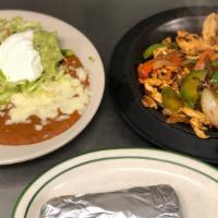 Lunch Fajitas · A lunch-sized portion of sizzling fajitas with your choice of beef or chicken and guacamole ...