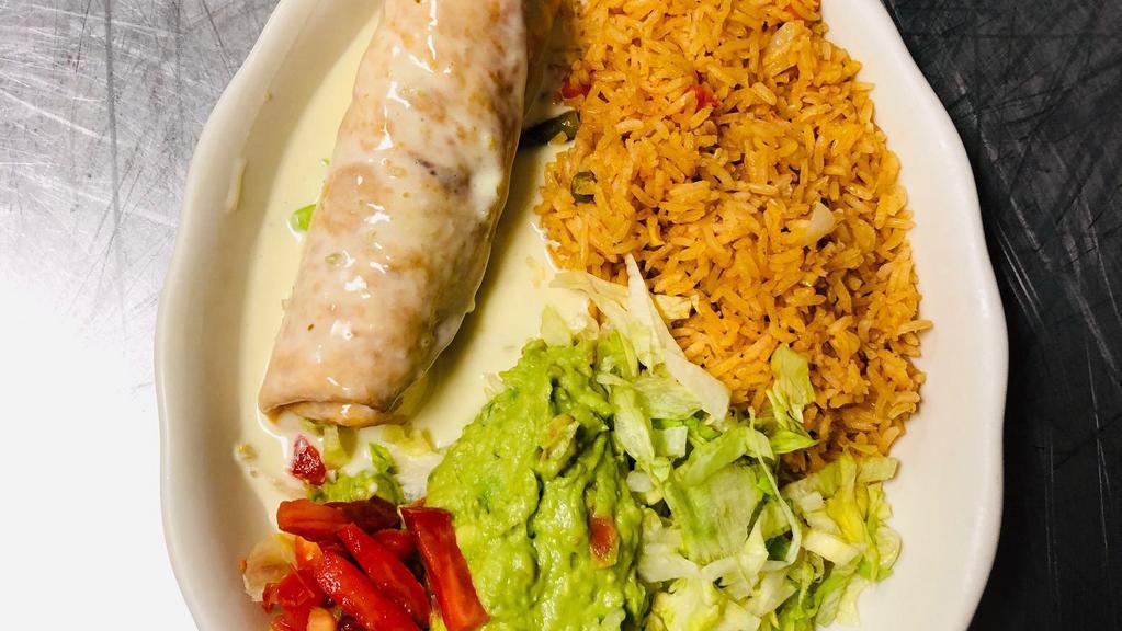 Lunch Chimichanga · Flour tortilla soft or fried, filled with beef tips and topped with lettuce, tomatoes, and guacamole. Served with rice.