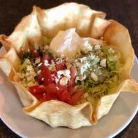 Taco Salad · Crispy flour tortilla shell with beef or chicken, beans, lettuce, tomatoes, cheese, and sour...