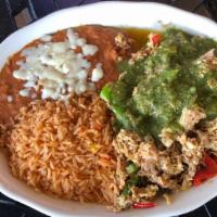 Huevos Mixtos · Scrambled eggs mixed with grilled bell peppers and shredded pork topped with green tomatillo...