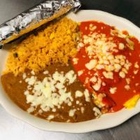 Huevos Rancheros · Two ranch-style eggs topped with Mexican sauce. Served with Mexican rice, beans, and tortill...