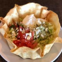 Fajita Taco Salad · Fajita-style chicken or beef in a crispy flour tortilla shell with beans, lettuce, tomatoes,...