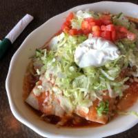 Burrito Deluxe · Two burritos-one chicken with beans and one beef with beans. Topped with lettuce, sour cream...